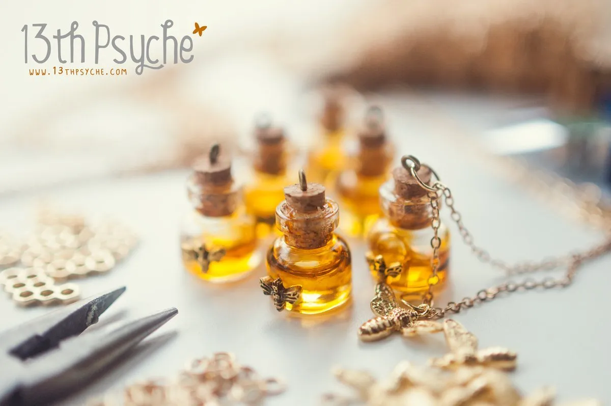 Honey bee and honeycomb bottle necklace